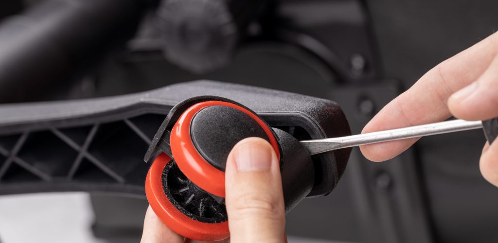 adjusting or repair office armchair. worker fixing arm chair. close up. diy concept.